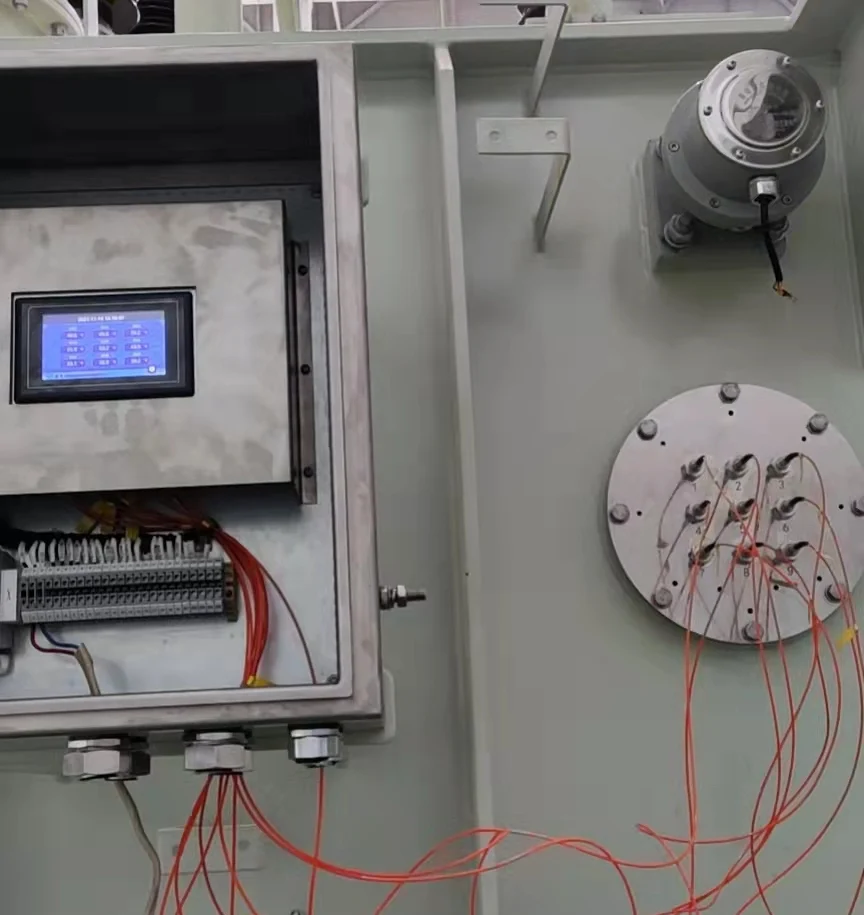 Transformer winding fiber optic temperature monitoring arrangement